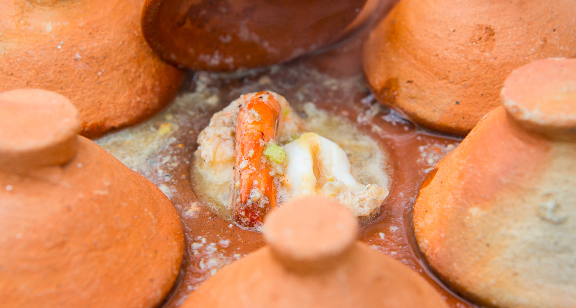 RIVER PRAWNS steamed in hot traditional clay pot